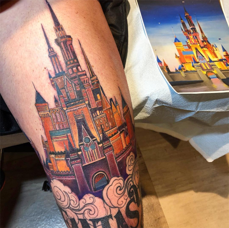 Cinderella Castle on his left thigh.
